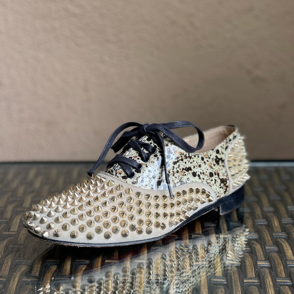 CHRISTIAN LOUBOUTIN gold spiked shoes